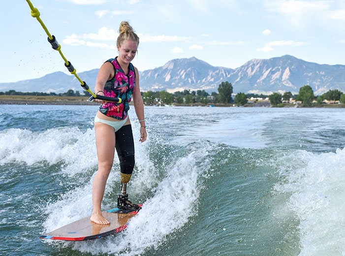 woman with prosthetic leg wake boarding